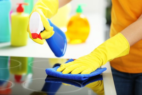 Cleaners keeping a work area tidy and hazard-free after service